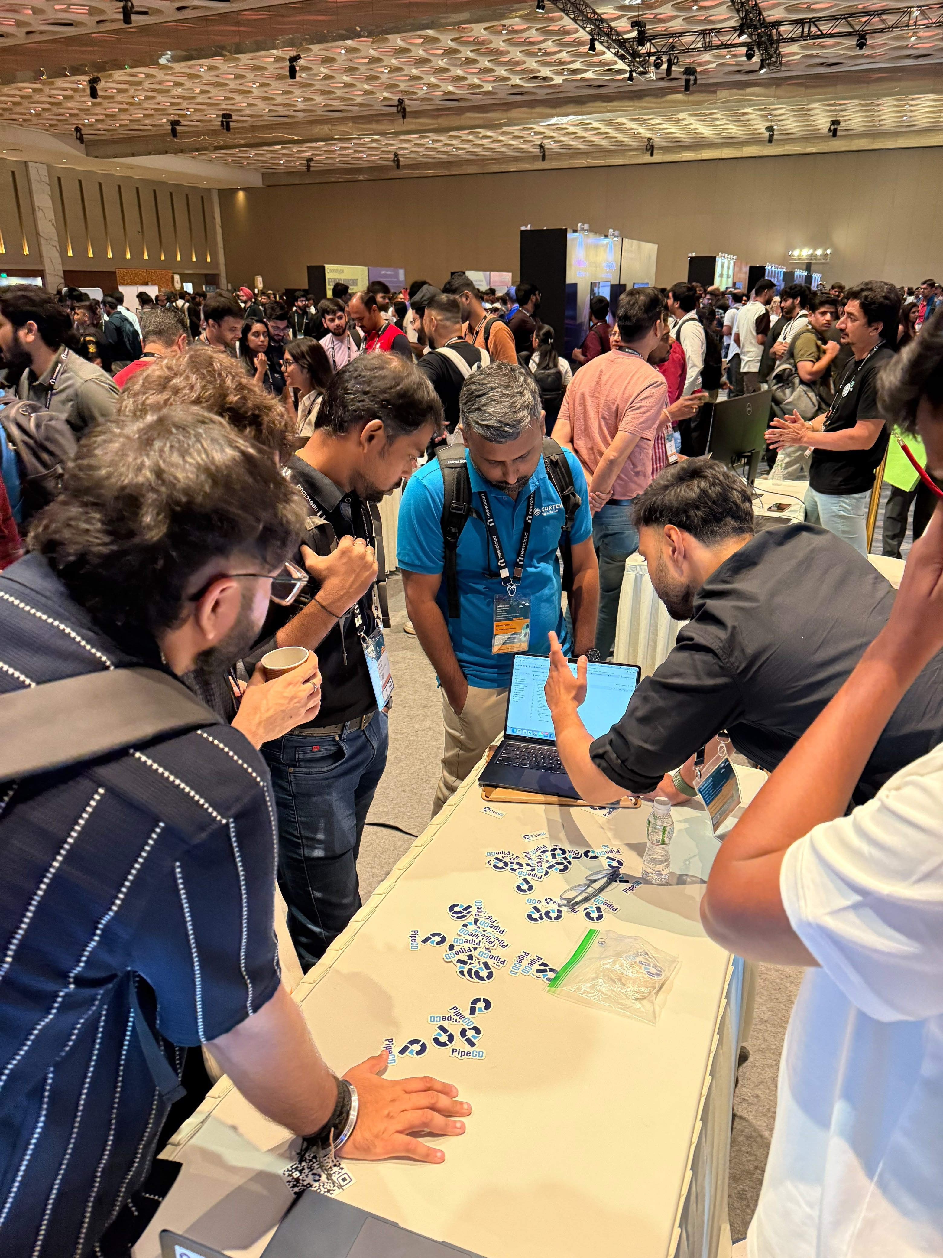 PipeCD booth — attendees exploring PipeCD at KubeCon India 2026